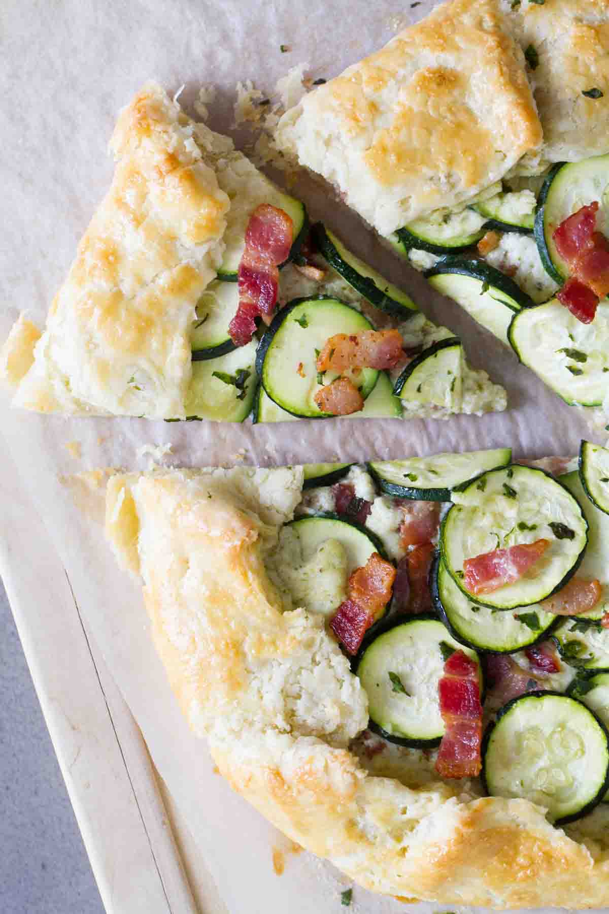 free form tart with zucchini, ricotta cheese, and bacon