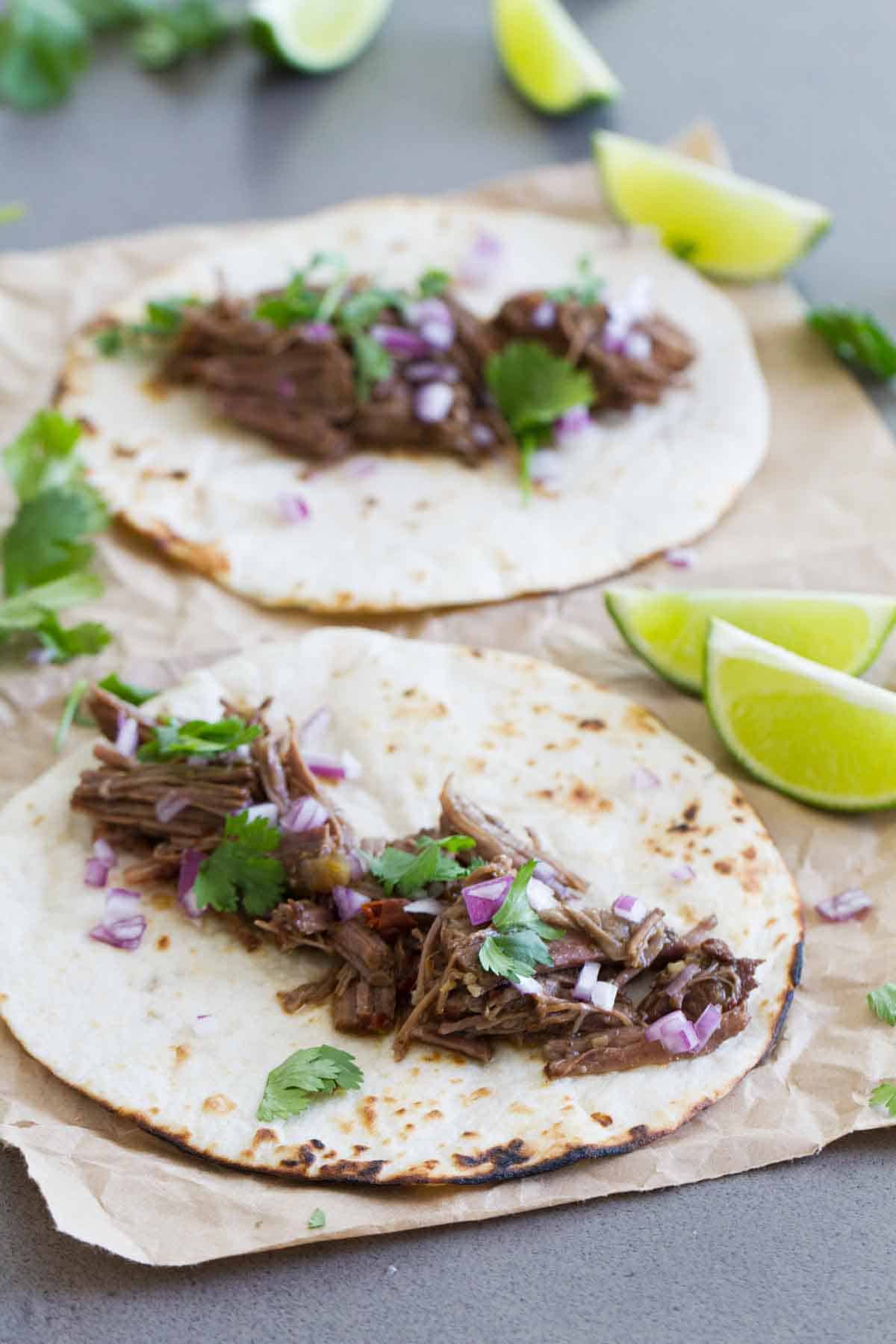 beef barbacoa on tortillas for tacos