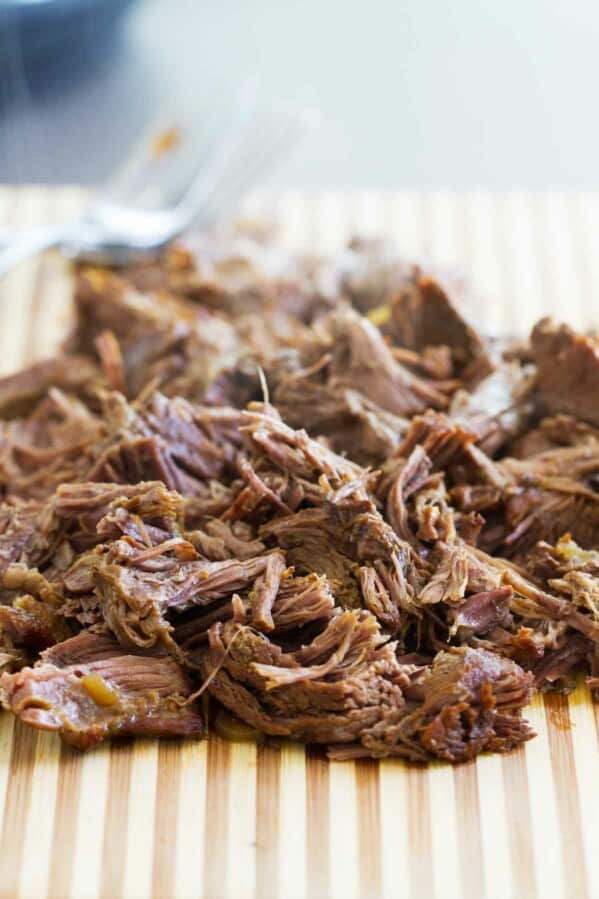 barbacoa beef on a cutting board