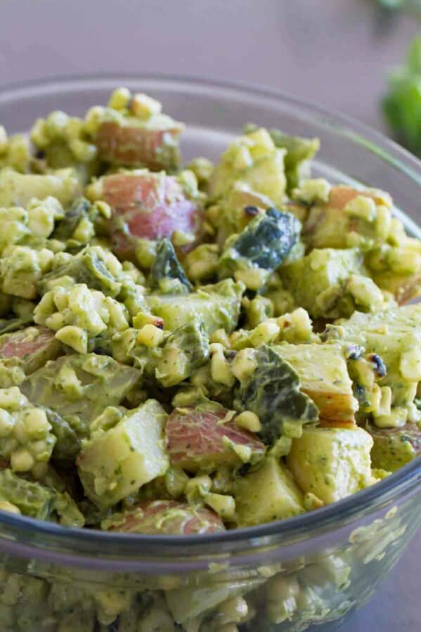 Potato salad with a Tex-Mex twist - this Potato Salad Recipe with Corn and Poblanos combines charred chiles and corn with potatoes and an avocado-cilantro dressing that’s irresistible.
