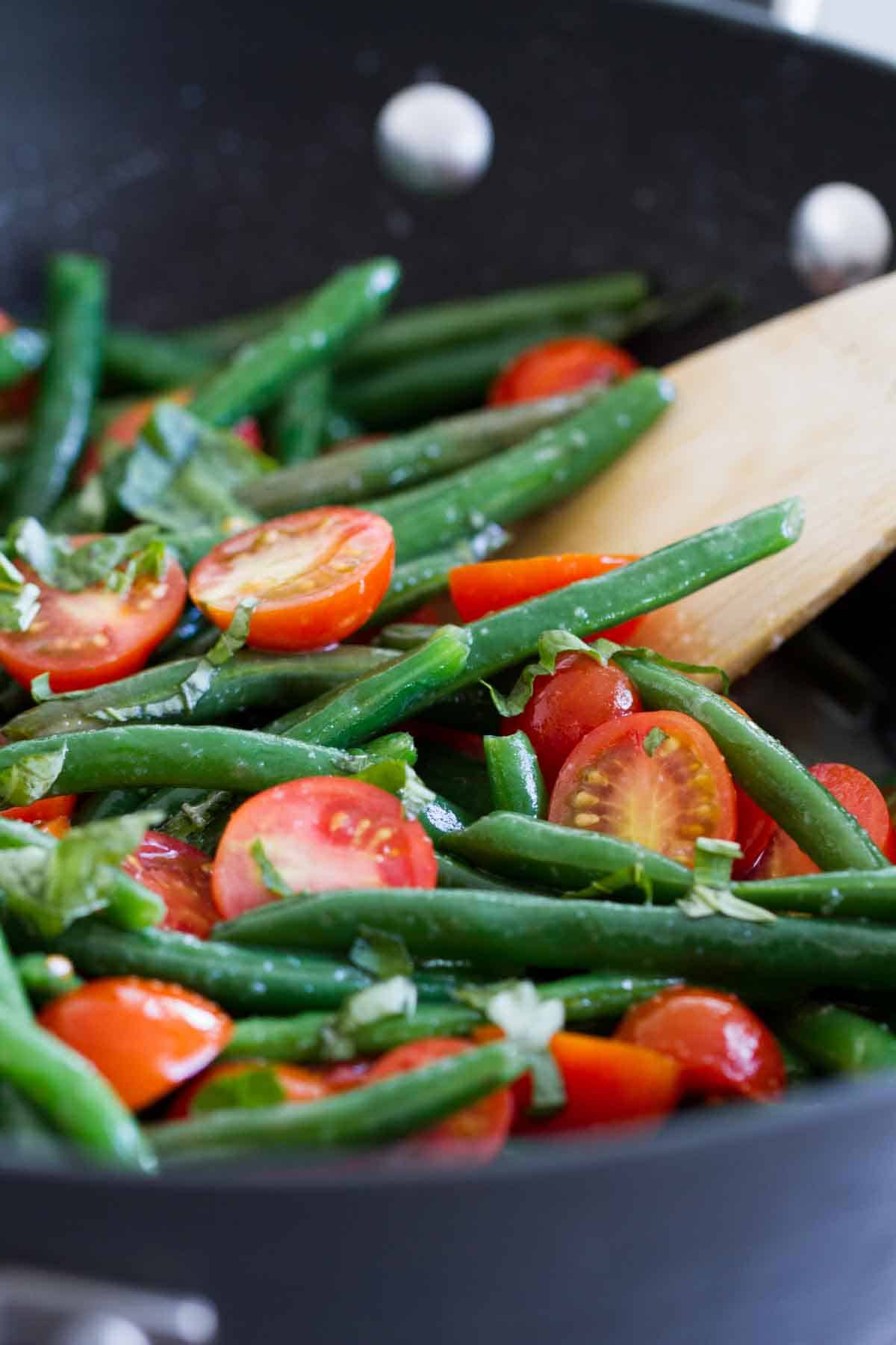 Fresh Sauteed Green Beans in a skillet with cherry tomatoes