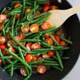 overhead view of sauteed green beans in a saute pan