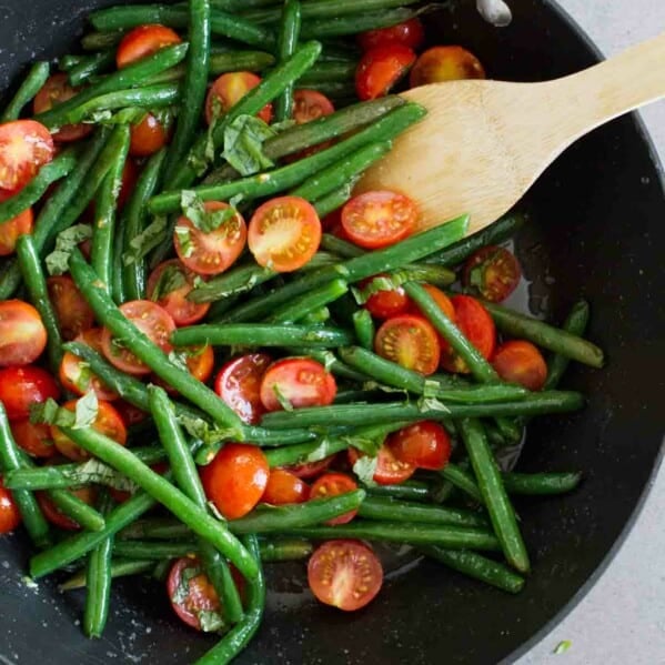 overhead view of sauteed green beans in a saute pan