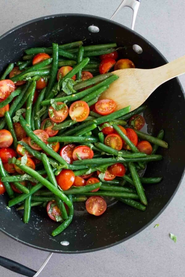 overhead view of sauteed green beans in a saute pan