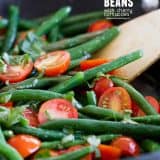 Sauteed Green Beans with Cherry Tomatoes in a pan with text in the corner