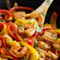 Close up of Shrimp Fajitas with peppers and onions.