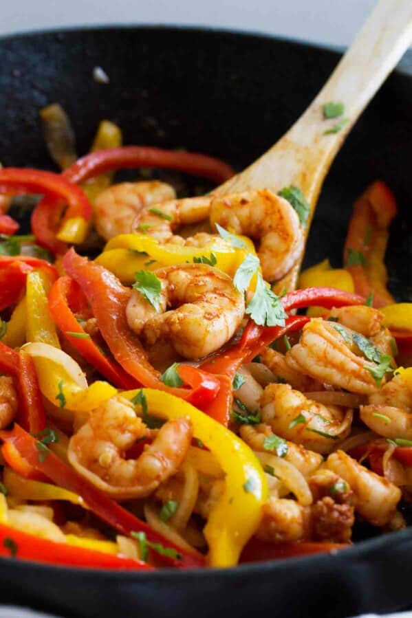 Close up of Shrimp Fajitas with peppers and onions.