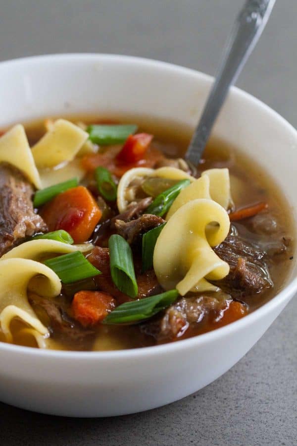Super tender and slow cooked, this Slow Cooker Beef Noodle Soup is the definition of comfort food! Put it in the slow cooker in the morning, and a flavorful noodle soup is ready for dinner!