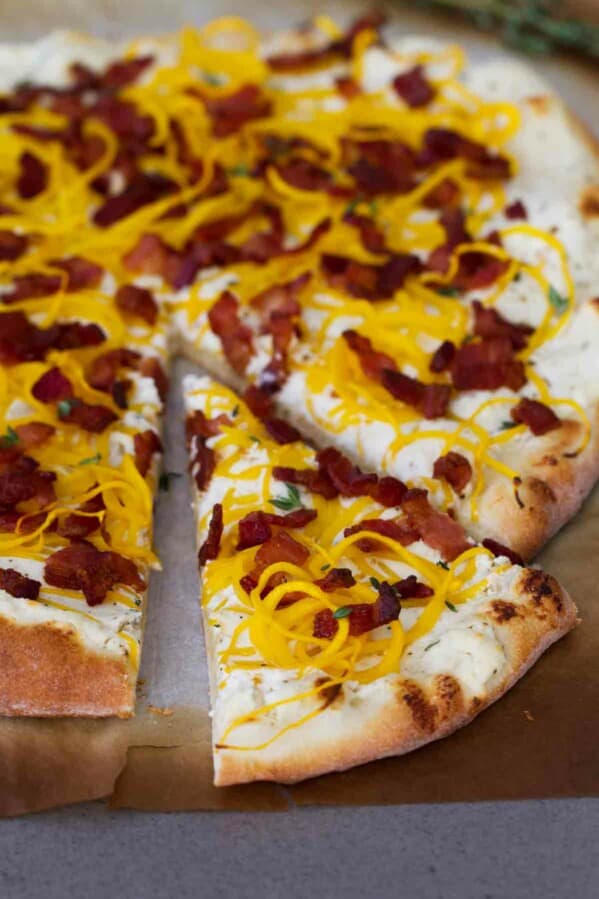 Bacon and Spiralized Butternut Squash Pizza with a slice cut out.