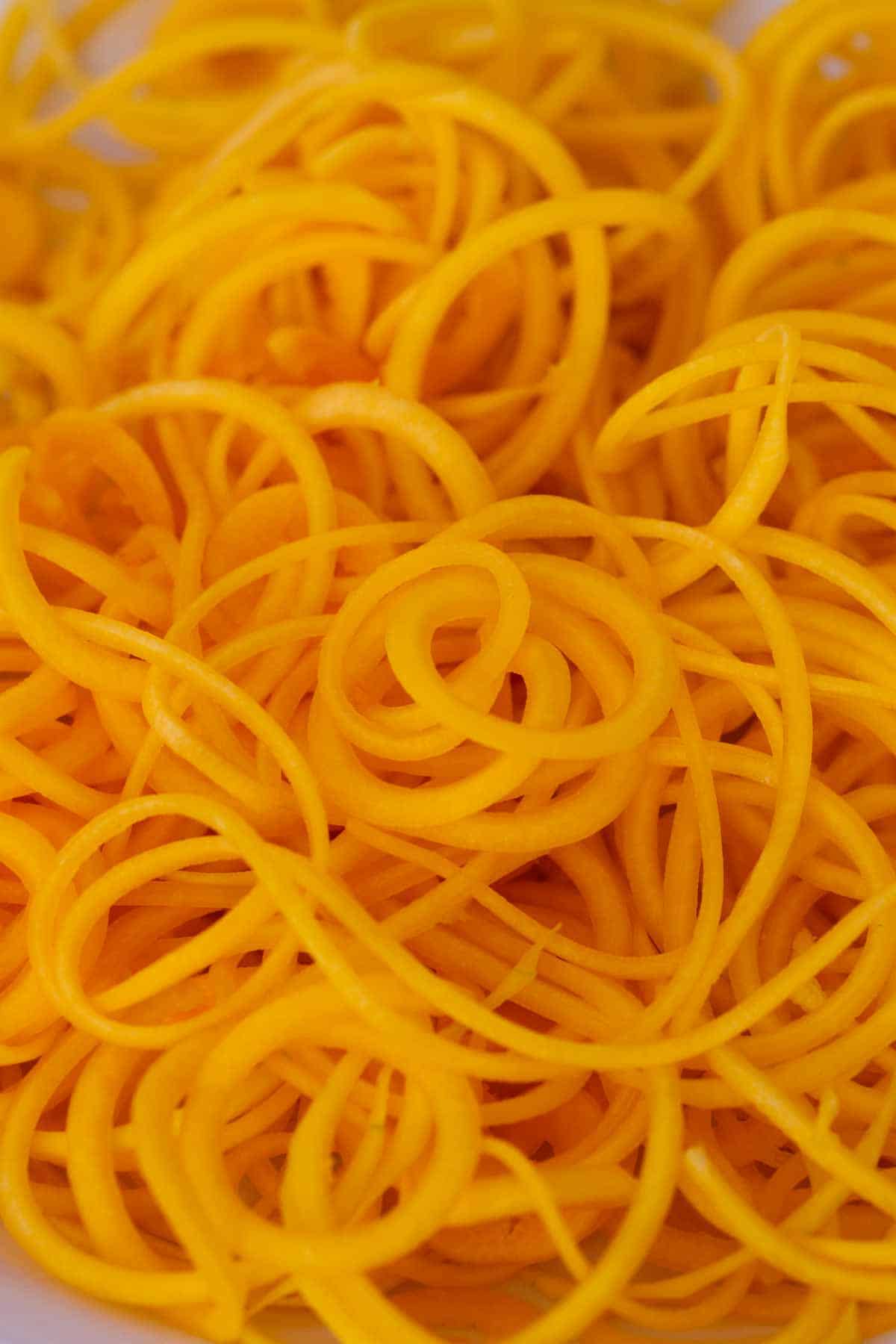 Pile of spiralized butternut squash.