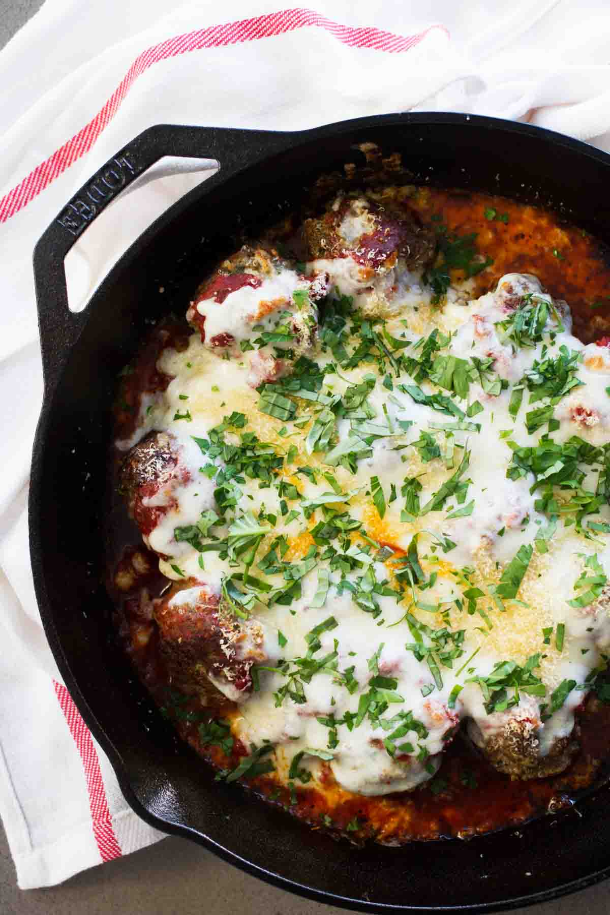 Meatball Parmesan skillet topped with mozzarella cheese.