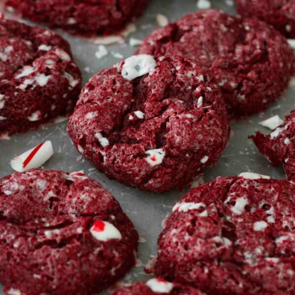 Red Velvet Peppermint Gooey Butter Cookies with pieces of broken candy canes.