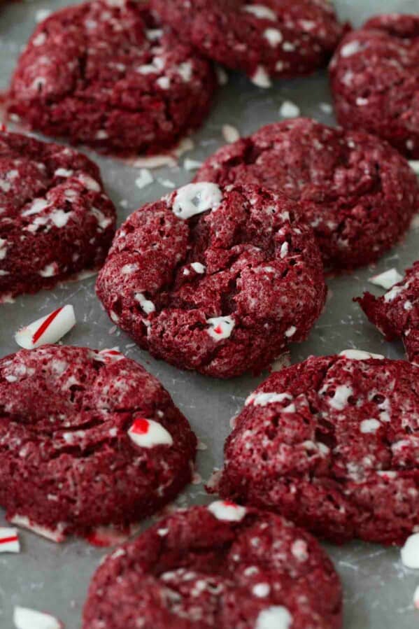 Red Velvet Peppermint Gooey Butter Cookies with pieces of broken candy canes.