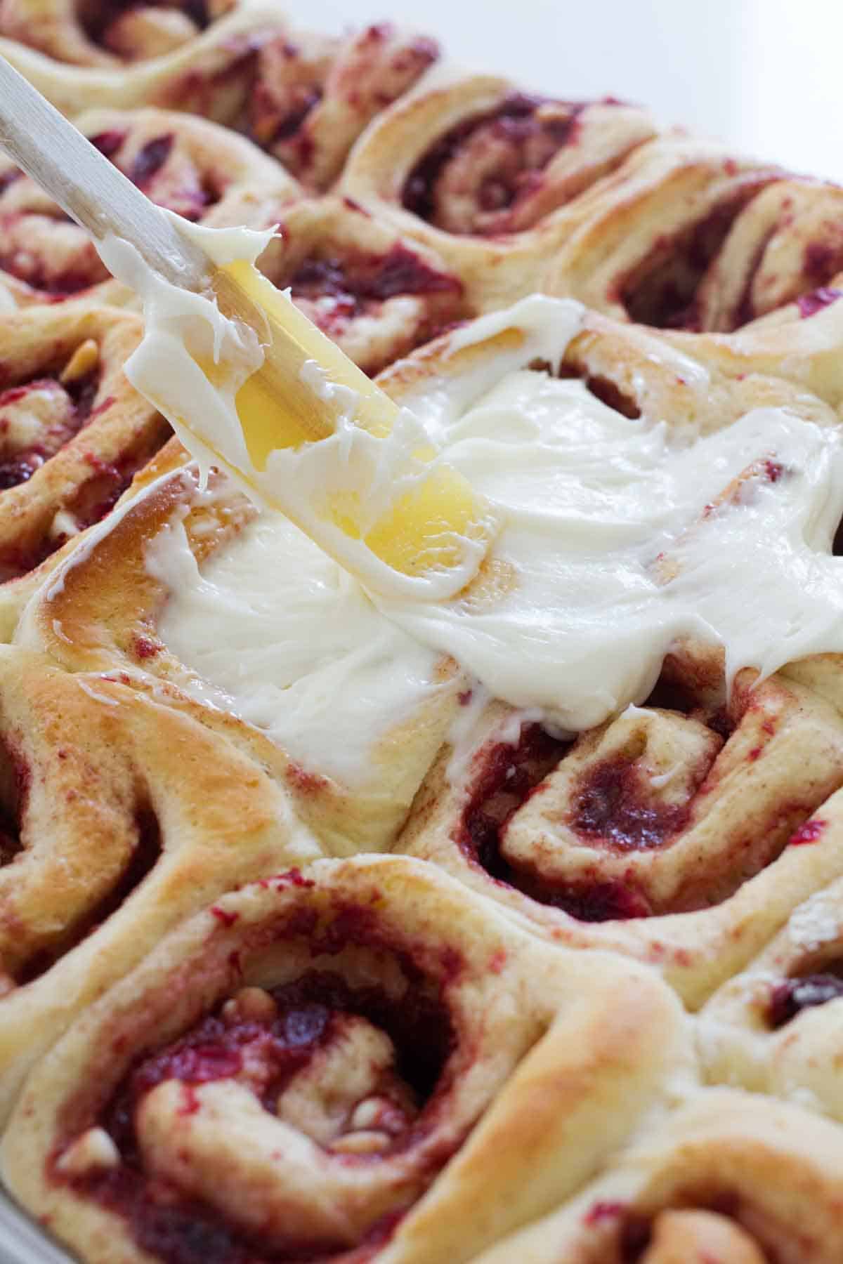 frosting cranberry cinnamon rolls