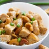 Cashew Chicken made in the Instant Pot in a bowl topped with green onion