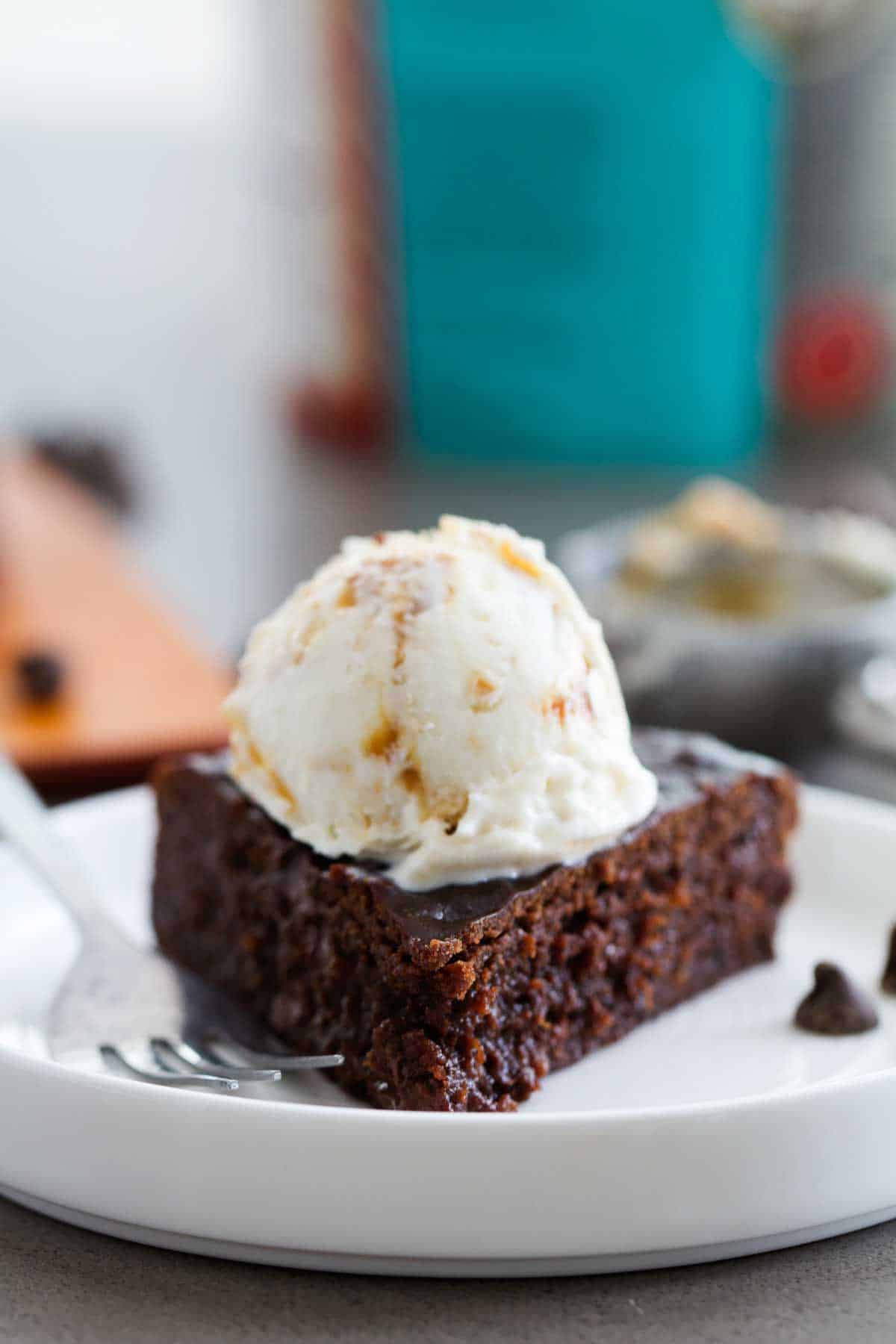 Pressure Cooker Fudgy Brownie topped with a scoop of ice cream.