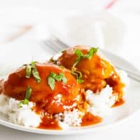 Instant Pot Honey Garlic Chicken over rice on a white plate.