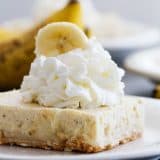Banana Cheesecake Cookie Bar topped with whipped cream.