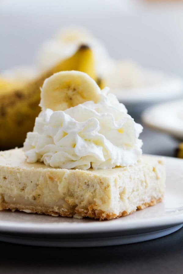 Banana Cheesecake Cookie Bar topped with whipped cream.