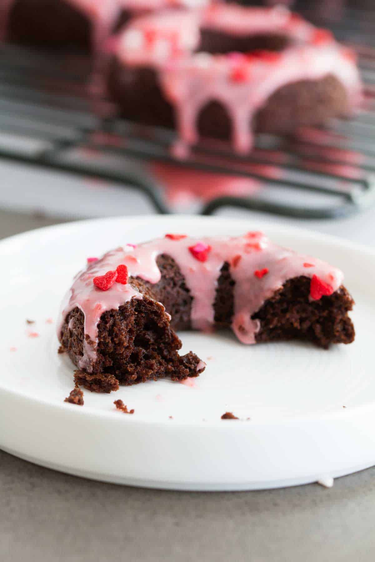 Baked Chocolate Donuts with Cherry Glaze cut donut