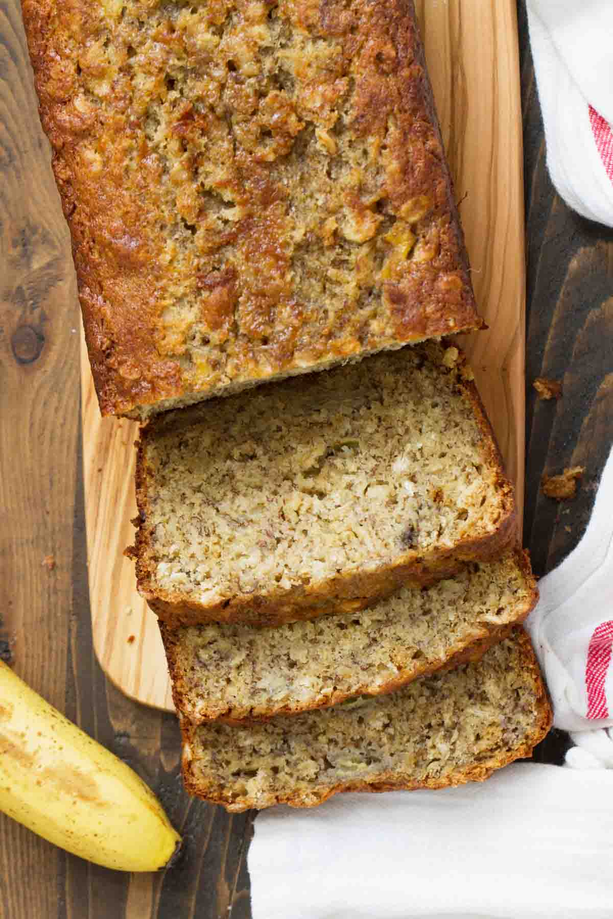Banana Oat Bread from the top with a few pieces sliced.