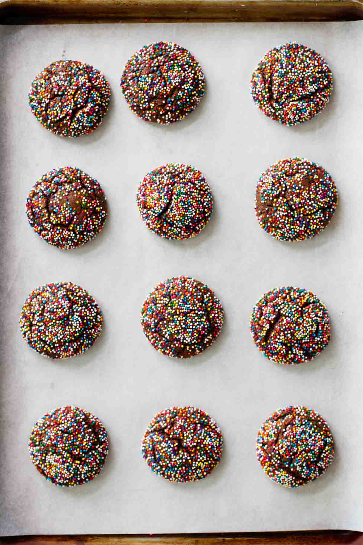 Chocolate Crinkle Sprinkle Cookies on a baking sheet