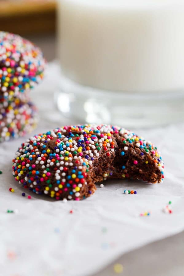 Chocolate Crinkle Sprinkle Cookie with a bite taken from it