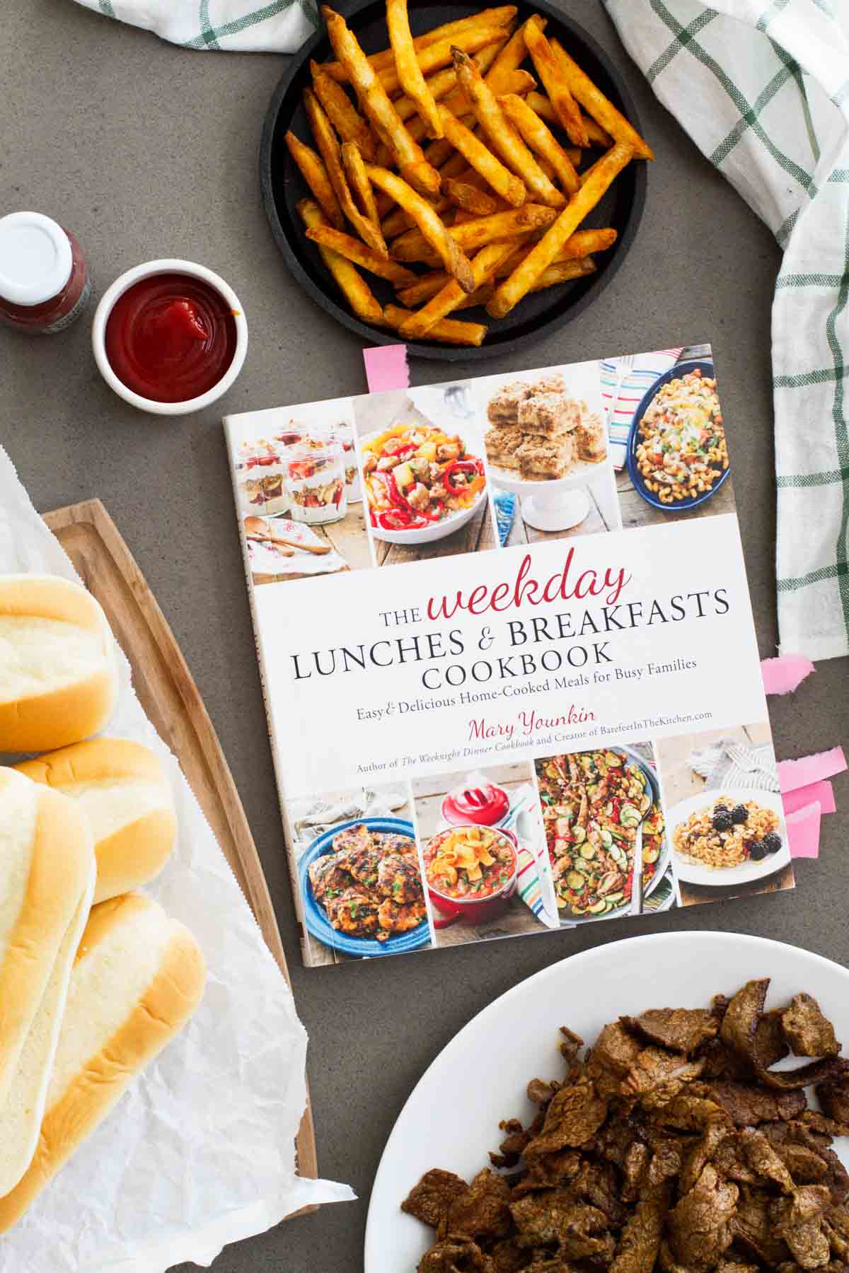 The Weekday Lunches & Breakfasts Cookbook surrounded by ingredients