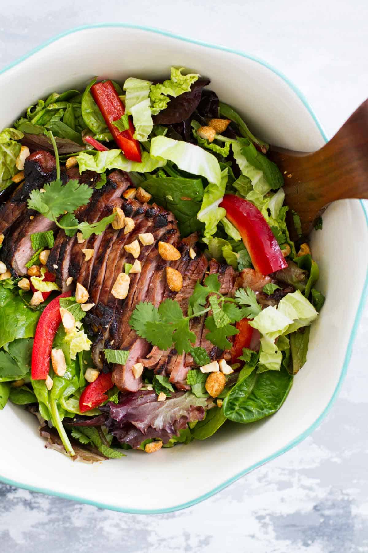 Thai Beef Salad in a salad bowl.