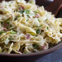 Artichoke pasta salad in a wooden bowl