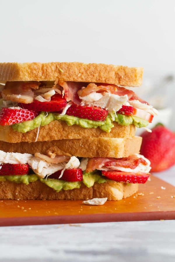 Chicken Club Sandwich with avocado and strawberries