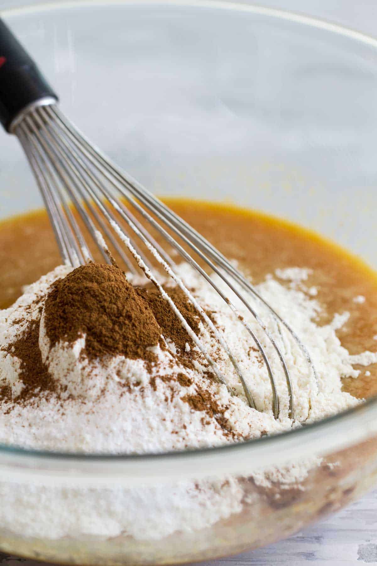 Mixing together ingredients for Cream Cheese Pumpkin Bread.