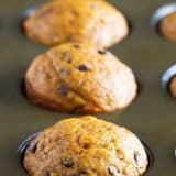 Pumpkin Muffins with Chocolate Chips in a muffin tin