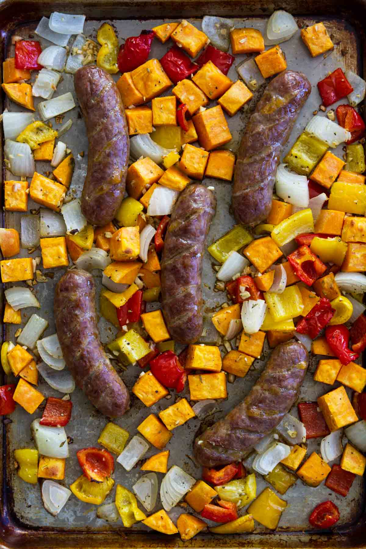 Sheet Pan Sausage and Peppers Recipe with Sweet Potatoes and onions