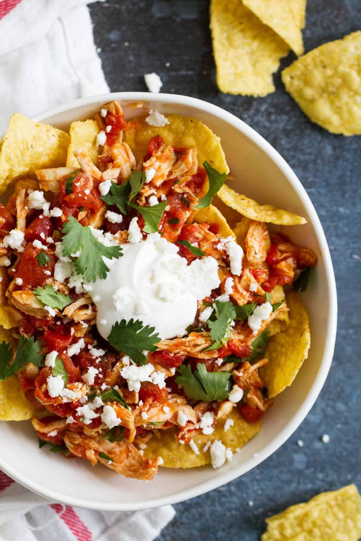 Easy Chilaquiles Recipe made with chicken and tortilla chips.