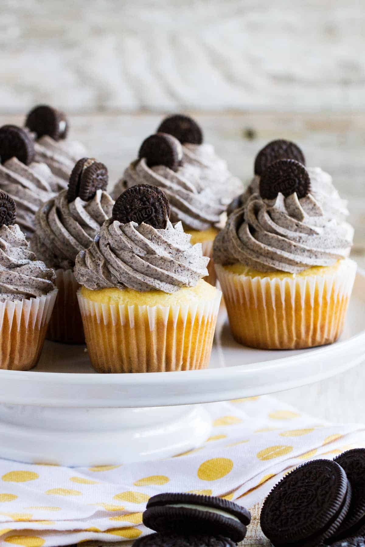Cookies and cream cupcakes topped with mini Oreos.