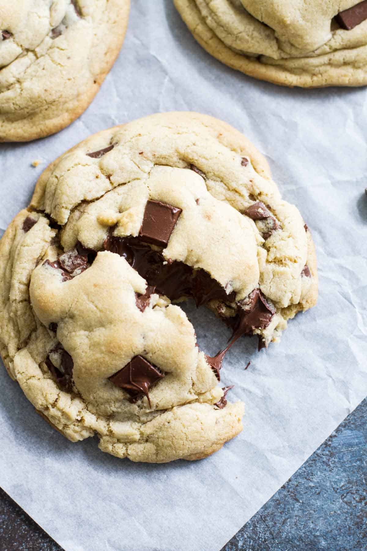 Giant Chocolate Chip Cookies, with one broken in half.