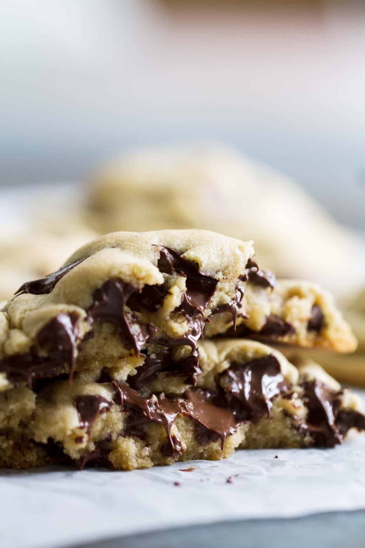 Gooey Chocolate Chip Cookie broken in half with melting chocolate.