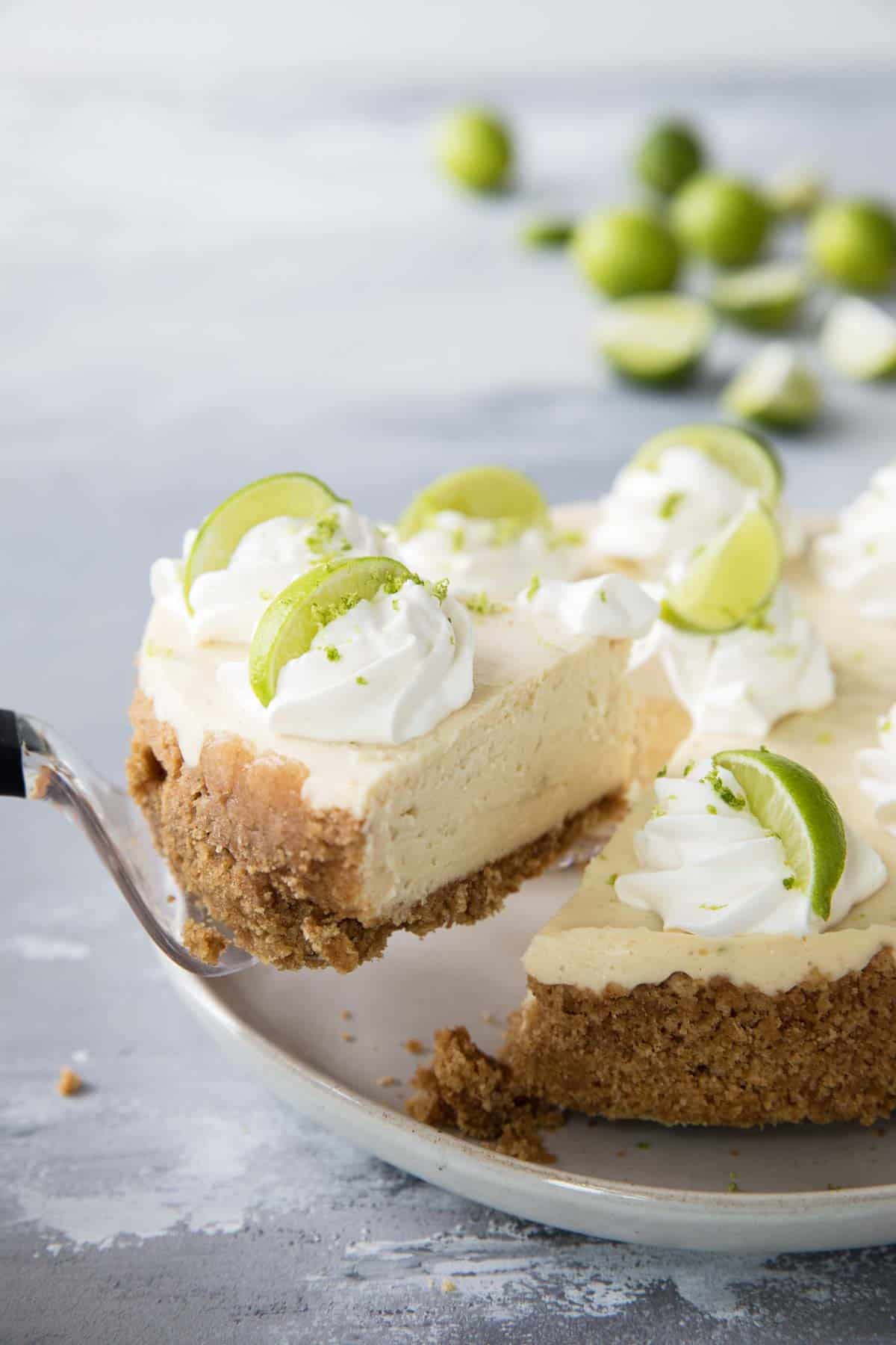 Slice of creamy Instant Pot Cheesecake with graham cracker crust.