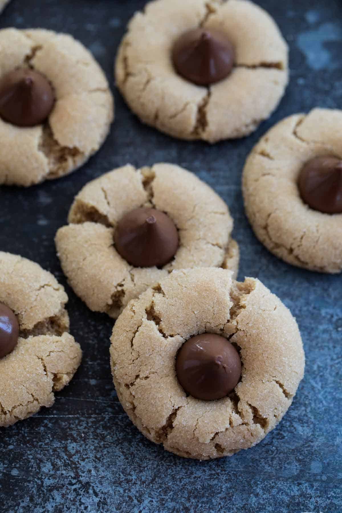 Peanut Butter Cookies with Chocolate Kisses on top stacked