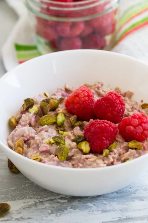 Overnight Oats with raspberries and pistachio nuts