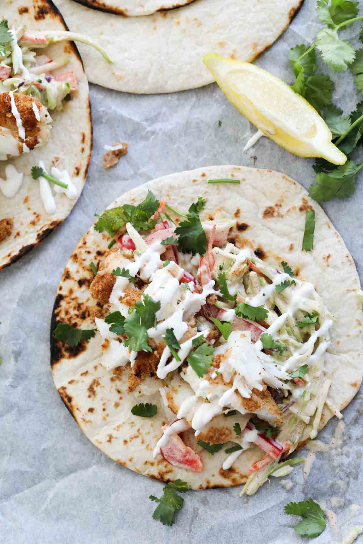 Flour tortillas topped with cajun spiced fish.