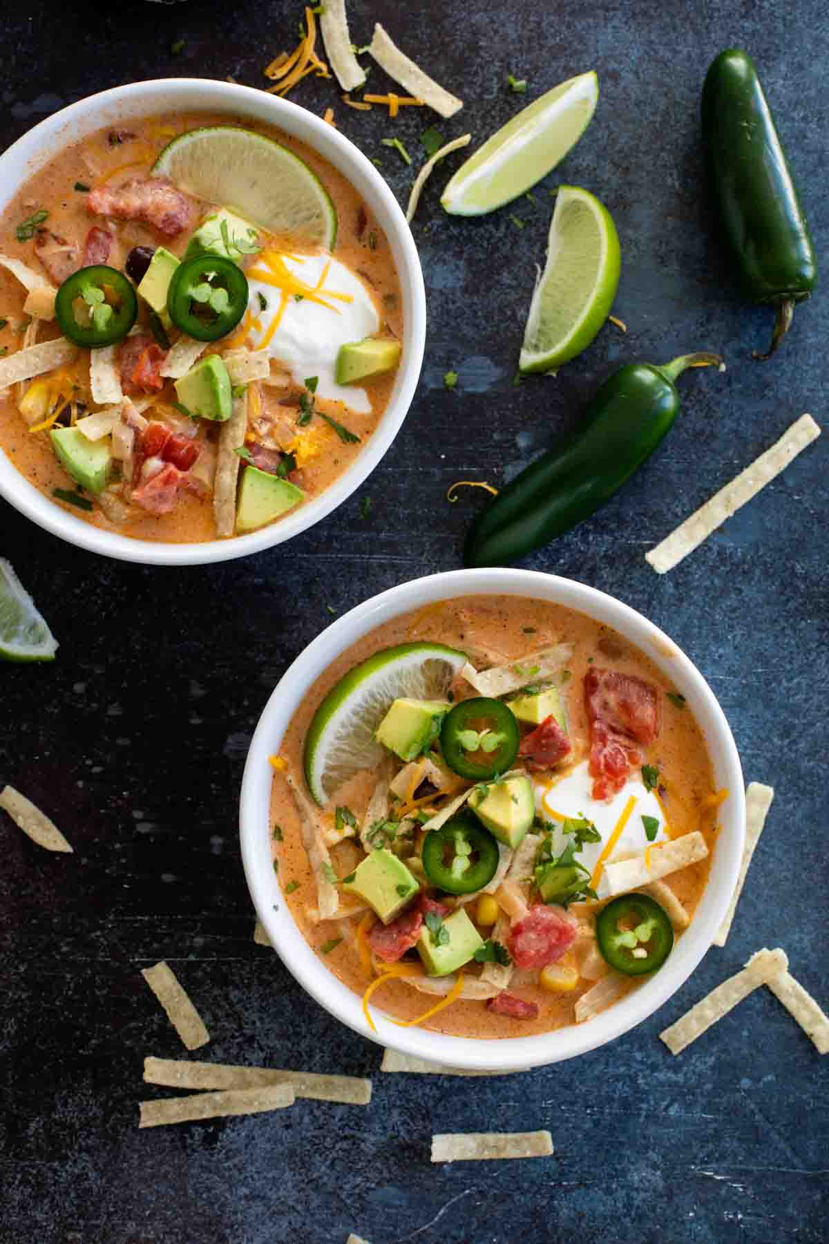 Two bowls of Creamy Chicken Tortilla Soup with toppings