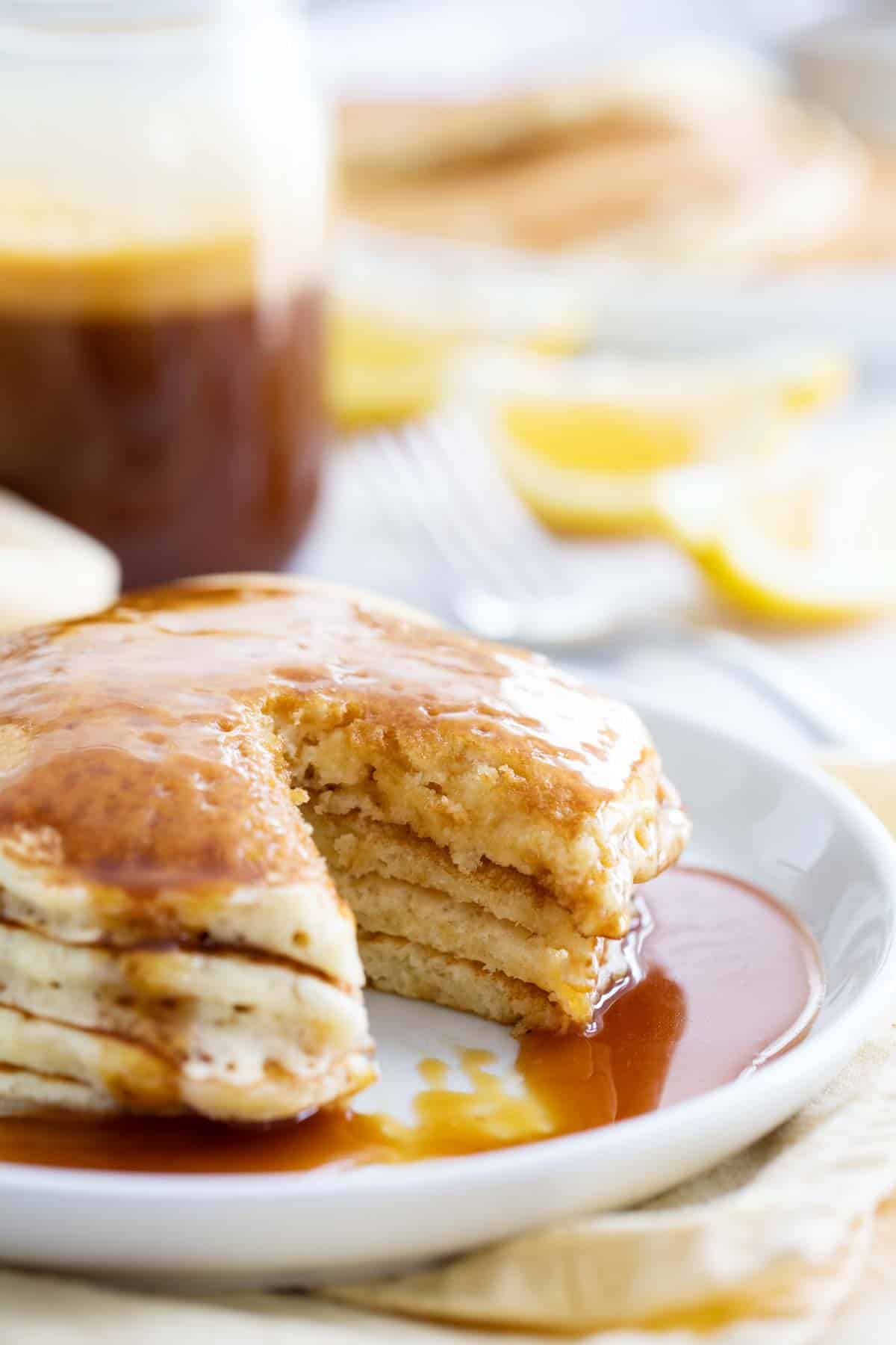 stack of lemon pancakes cut open to show texture