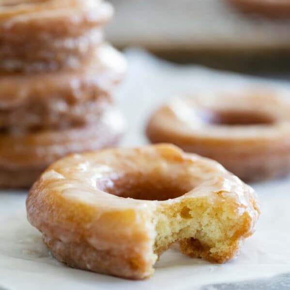 Glazed Cake Donut with a bite taken from it.