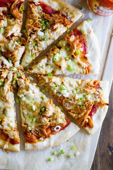 buffalo chicken pizza topped with cheese and green onions