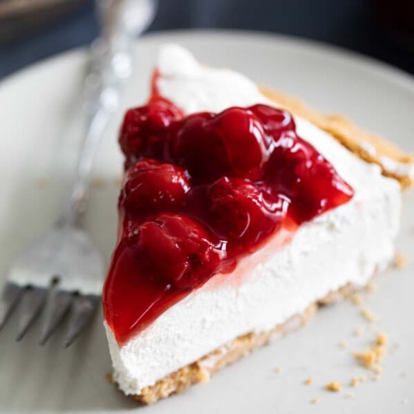 Slice of No Bake Cheesecake with Cherry Topping