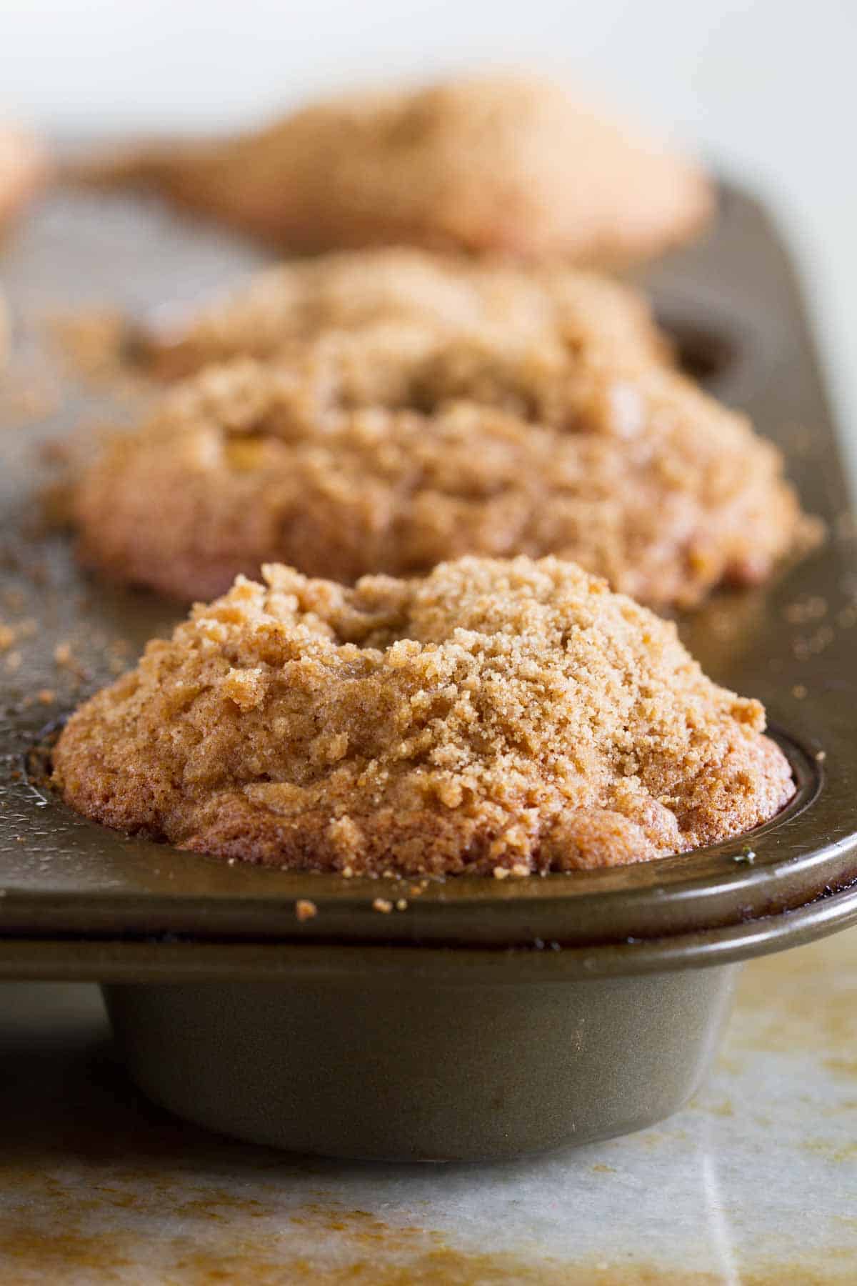 Apple cinnamon muffins in a muffin tin