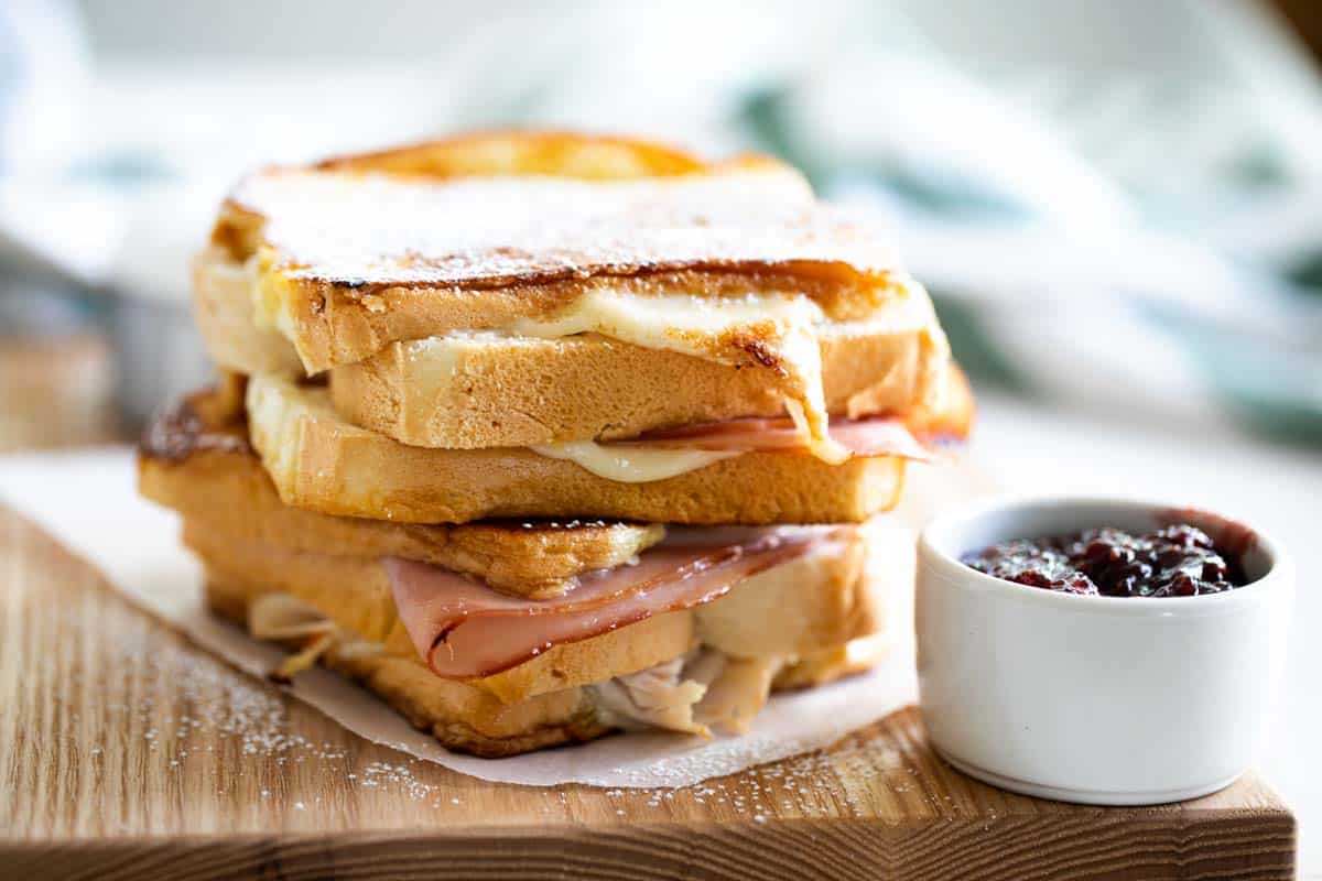 2 full monte cristo sandwiches stacked on top of each other