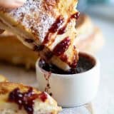 Dipping a Monte Cristo Sandwich into Jam